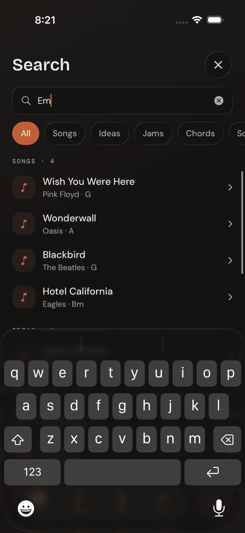 Search tab with the query "Em" showing mixed song and chord results